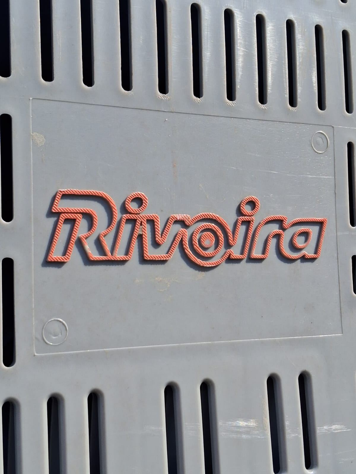 Rivoira logo on a storage crate at the production facility Rivoira apple sorting facility